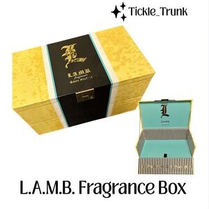 L.A.M.B. Gold and Black Fragrance Box with Teal Interior